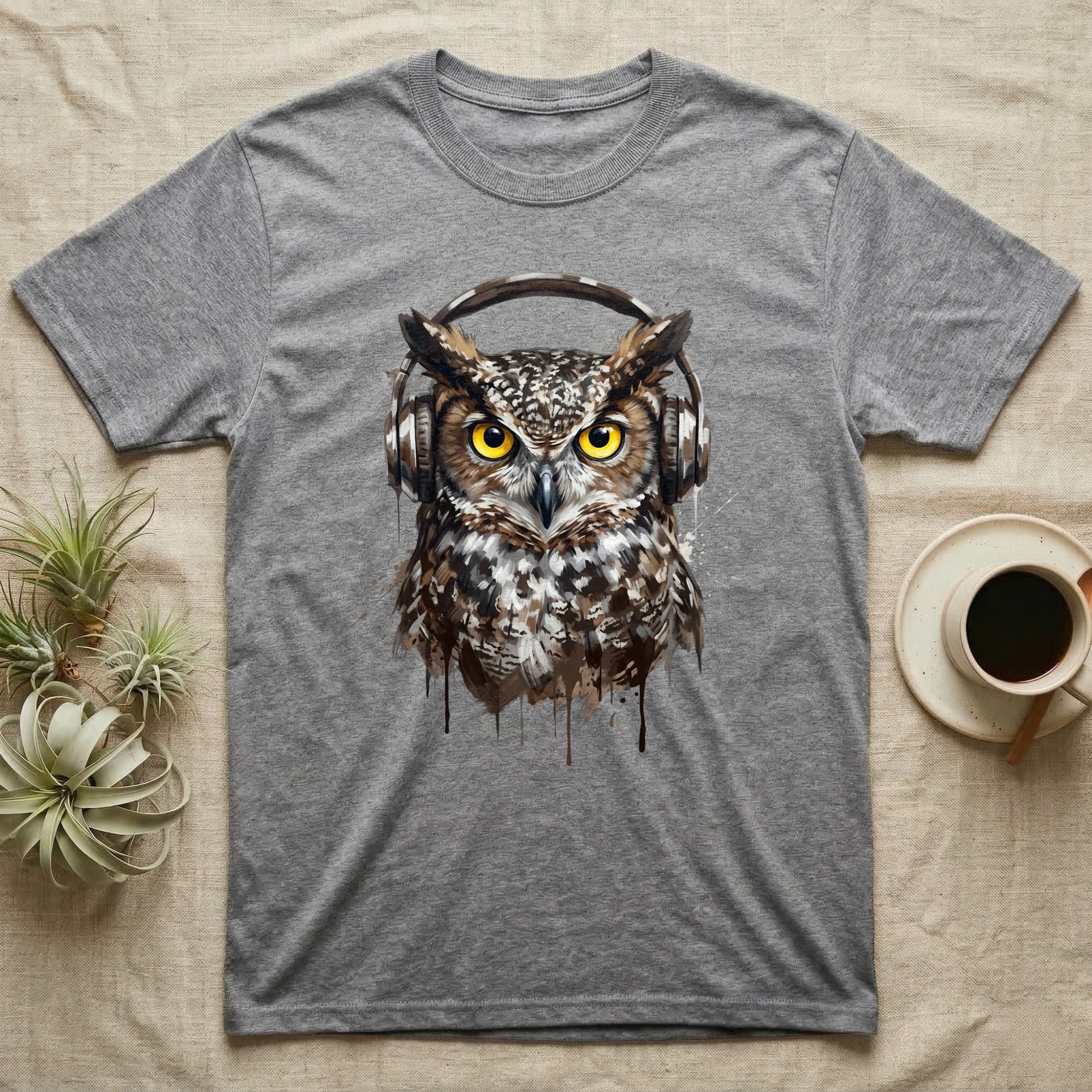 Gray t-shirt with a watercolor-style owl wearing headphones.