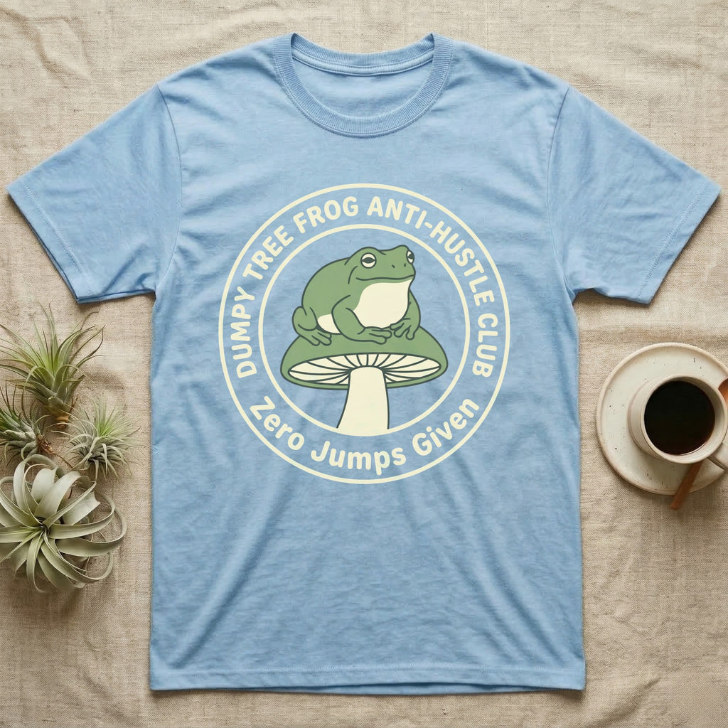 Light blue t-shirt with "Dumpy Tree Frog Anti-Hustle Club Zero Jumps Given" graphic.