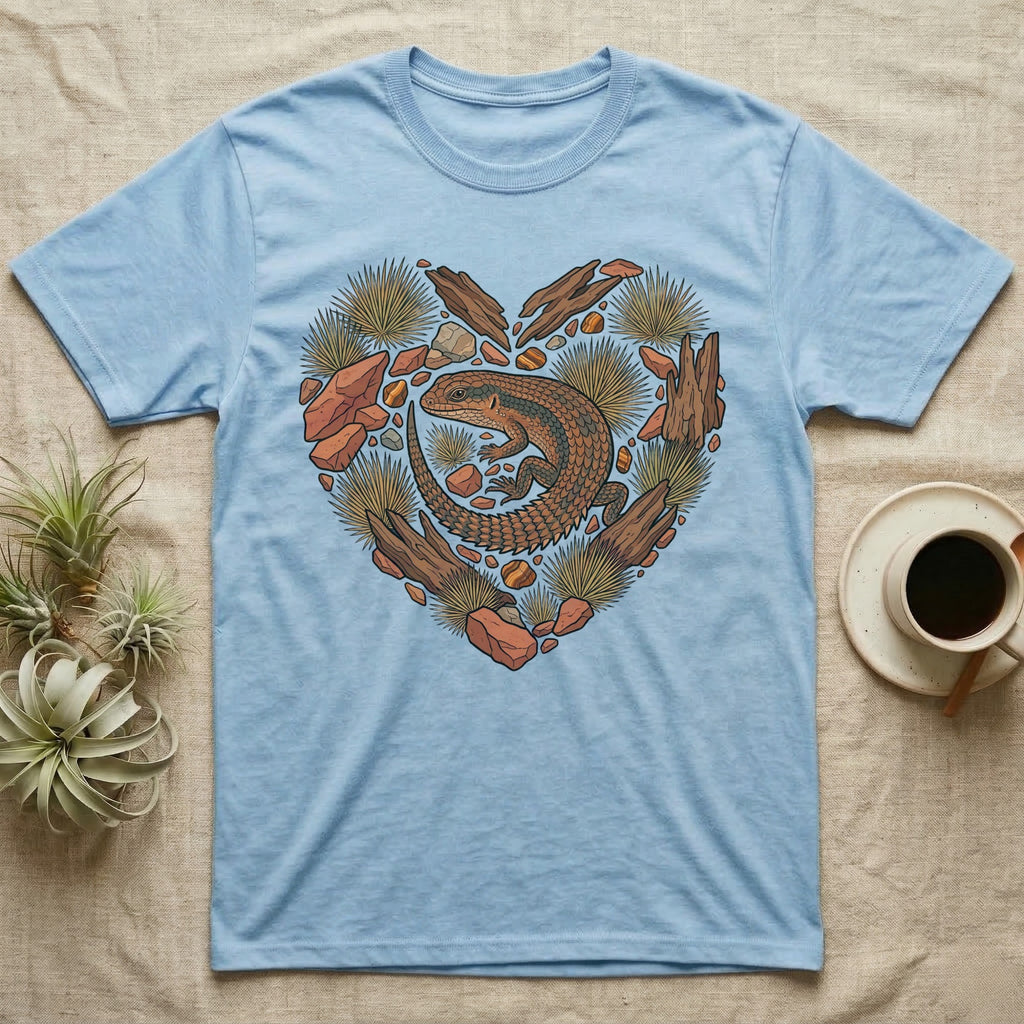 Light blue t-shirt with a heart-shaped desert scene featuring a lizard.