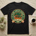 Tortoise Slow-oween Parade T-Shirt in Black — Distressed badge of a witch-hatted tortoise pulling a pumpkin wagon, "Slow-oween Parade, Division Last Place."