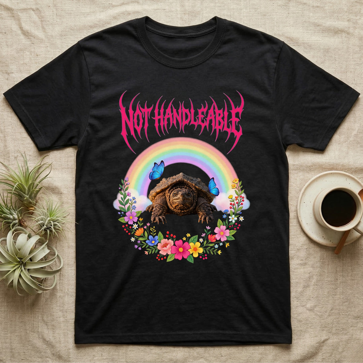 Snapping Turtle Hatchling T-Shirt in Black — Cute baby snapping turtle in a pastel rainbow and flower wreath under a hot pink metal logo reading NOT HANDLEABLE