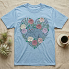 Light blue t-shirt with a grey cat within a floral heart design.