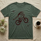 Tree Frog Can-Can T-Shirt in Military Green — Distressed one-ink oxblood screenprint of a White's tree frog airborne on a BMX bike, both back legs kicked off the pedals and swung to one side, hands still on the bars.