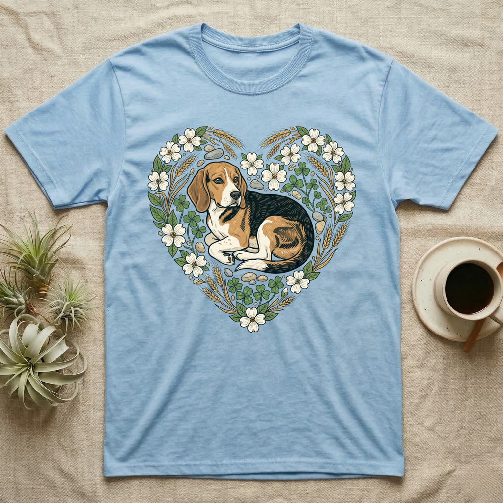 Beagle dog inside a floral heart on a light blue t-shirt.