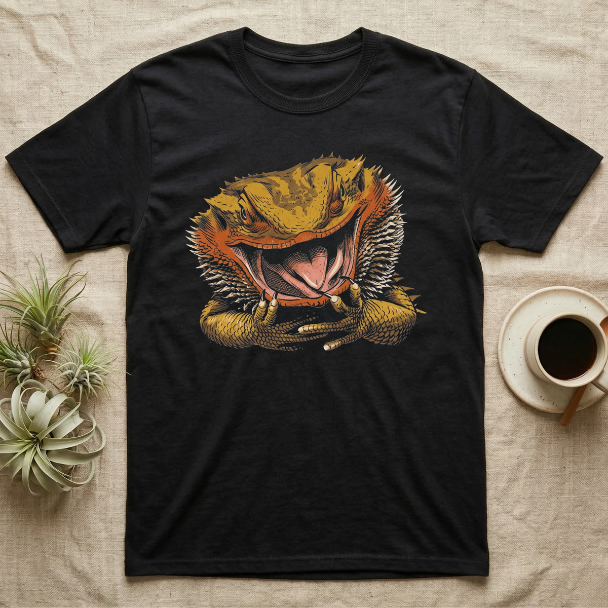 Vintage ink illustration of a bearded dragon head with its mouth wide open, tongue out, front claws raised, no on-shirt text. — shown on a Black tee.