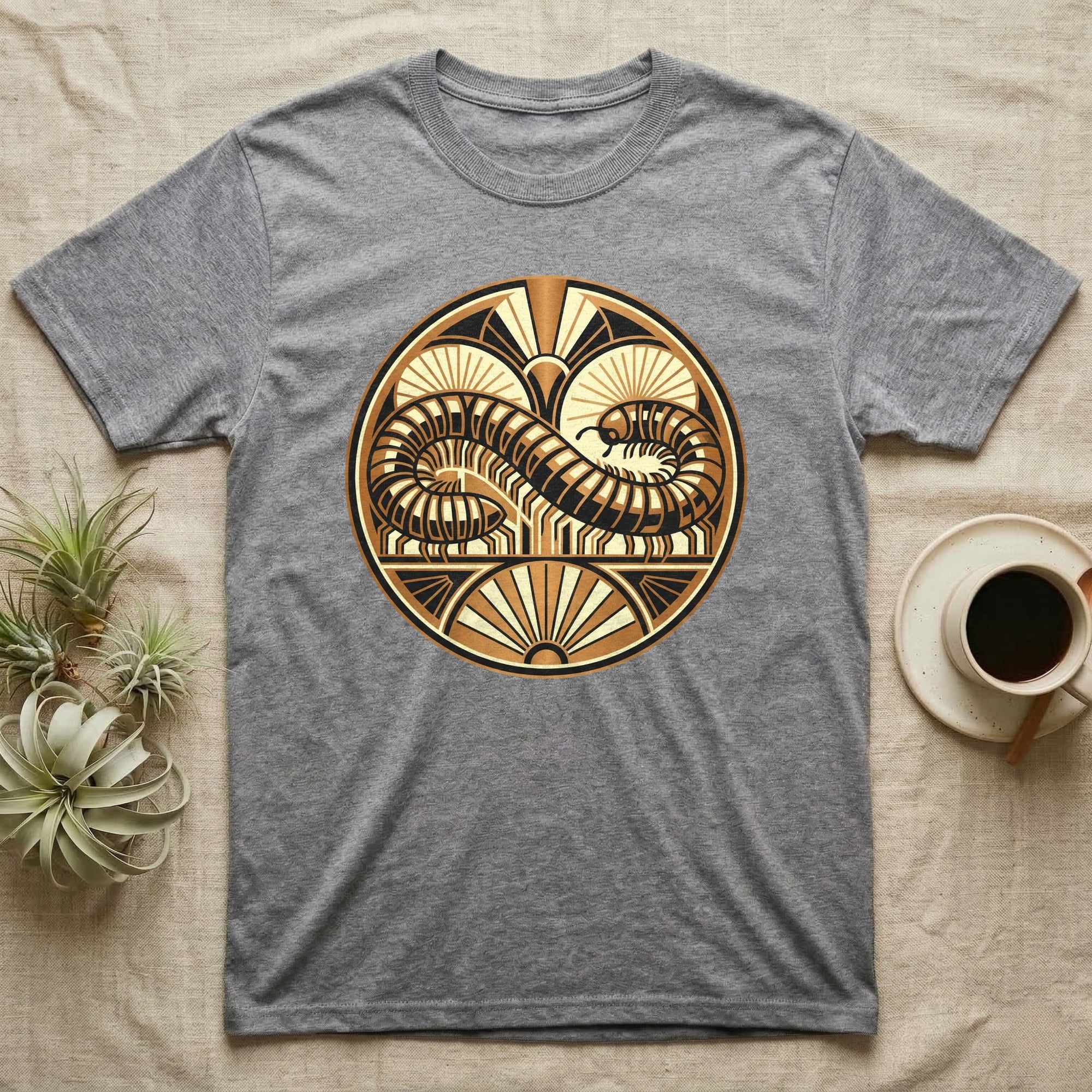 Gray t-shirt with circular art deco design featuring a stylized serpent.