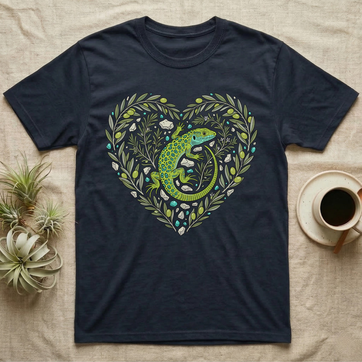 Dark t-shirt with green lizard and floral heart design.