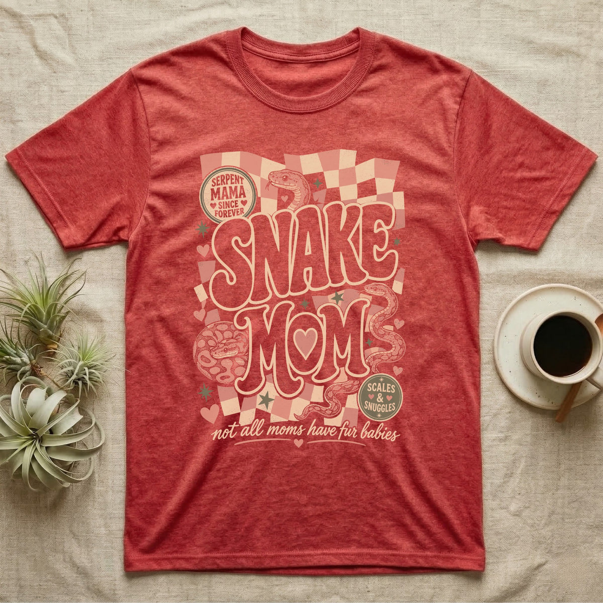 Red t-shirt with "Serpent Mama" and "Snake Mom" text and snake graphics.