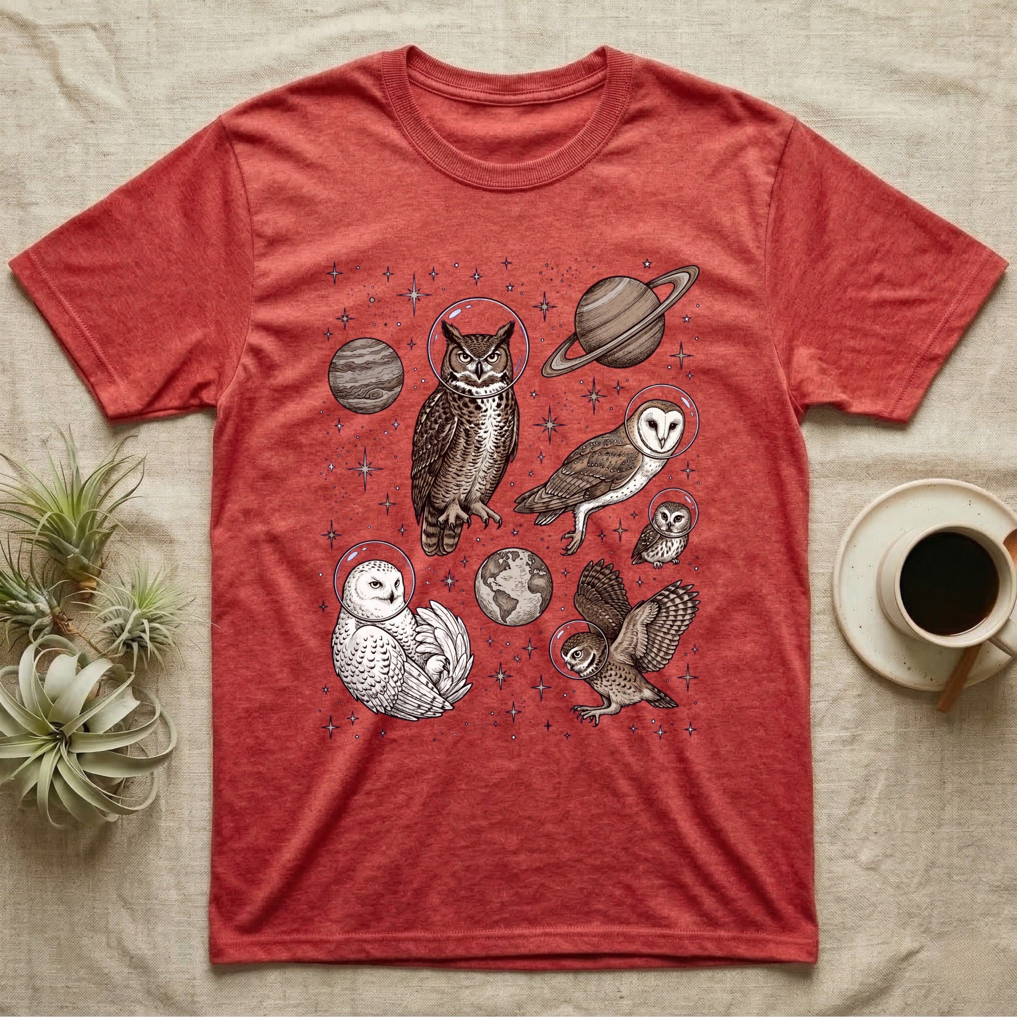 Red t-shirt with astronaut owls and planets graphic.