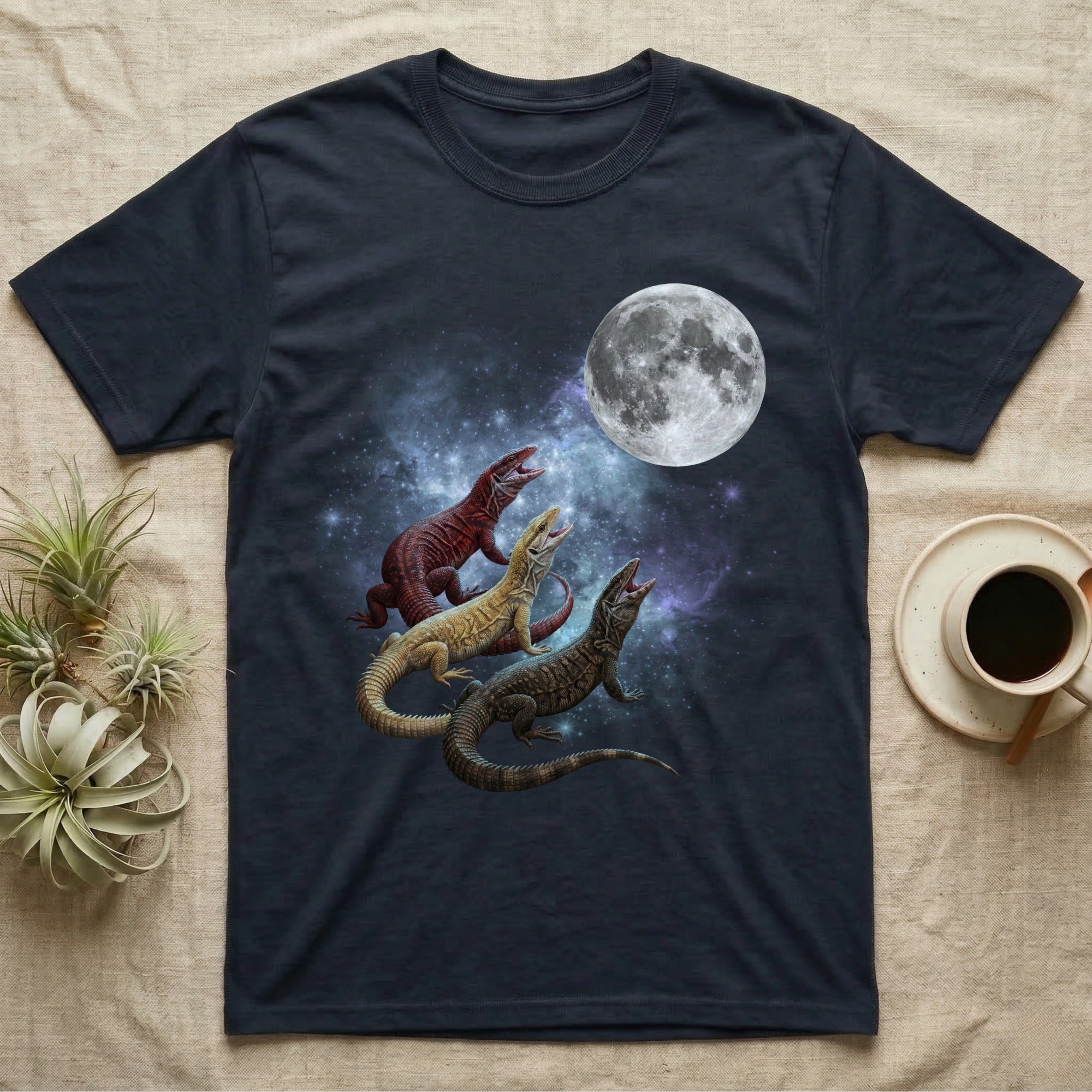 Ackie Monitor Moon Howl T-Shirt in Navy — Three Ackie Monitor colour morphs howling at a full moon over a nebula on a dark grey t-shirt.