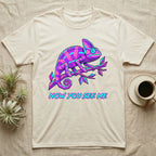 T-shirt with neon chameleon design and text "Now You See Me".