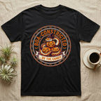 Ball Python Boa-Constricted Candy T-Shirt in Black — Distressed badge of a witch-hatted ball python on three jack-o'-lanterns, "Boa-Constricted by the Candy."