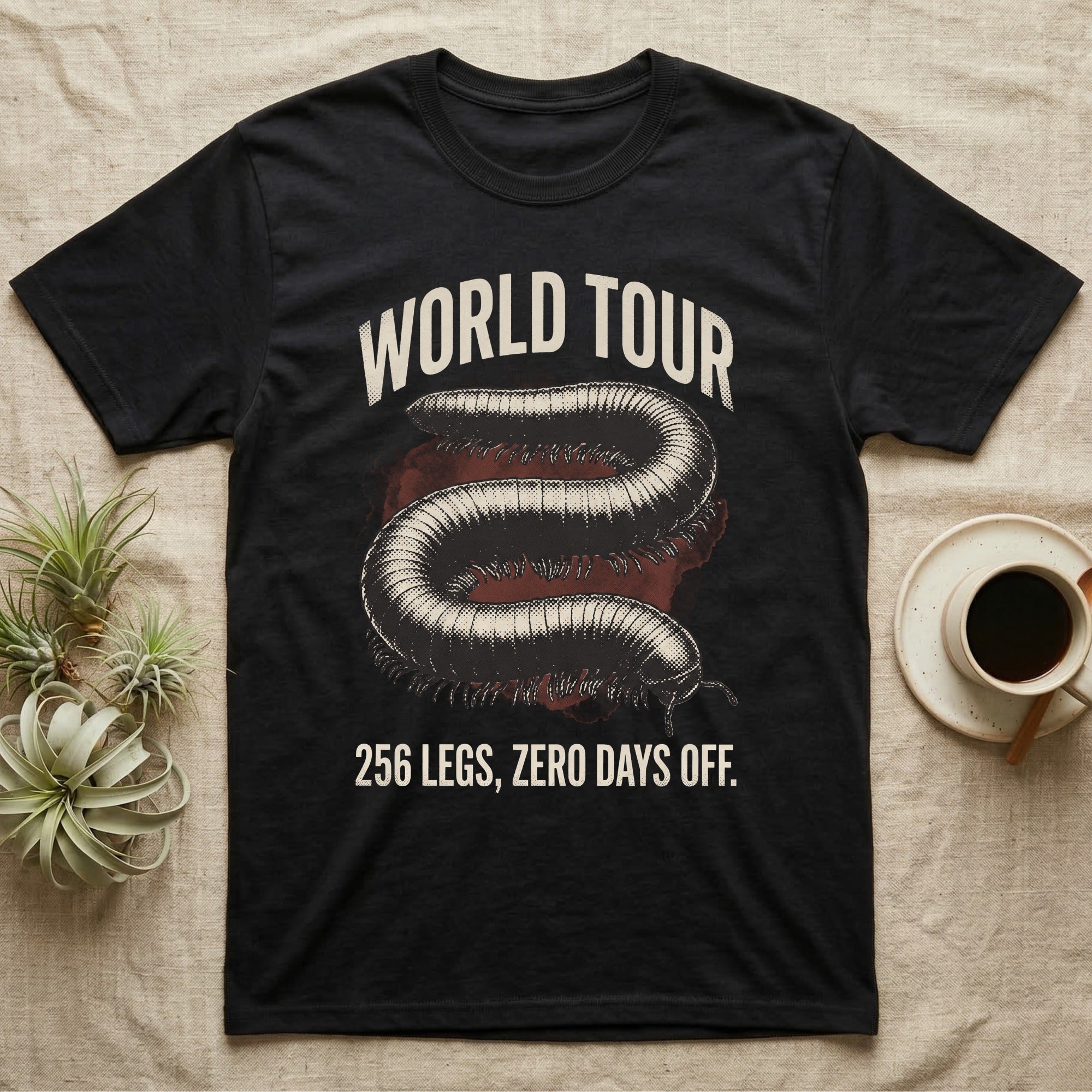 African Millipede World Tour T-Shirt in Black — Bootleg tour-merch halftone illustration of a giant African millipede as the headline act.