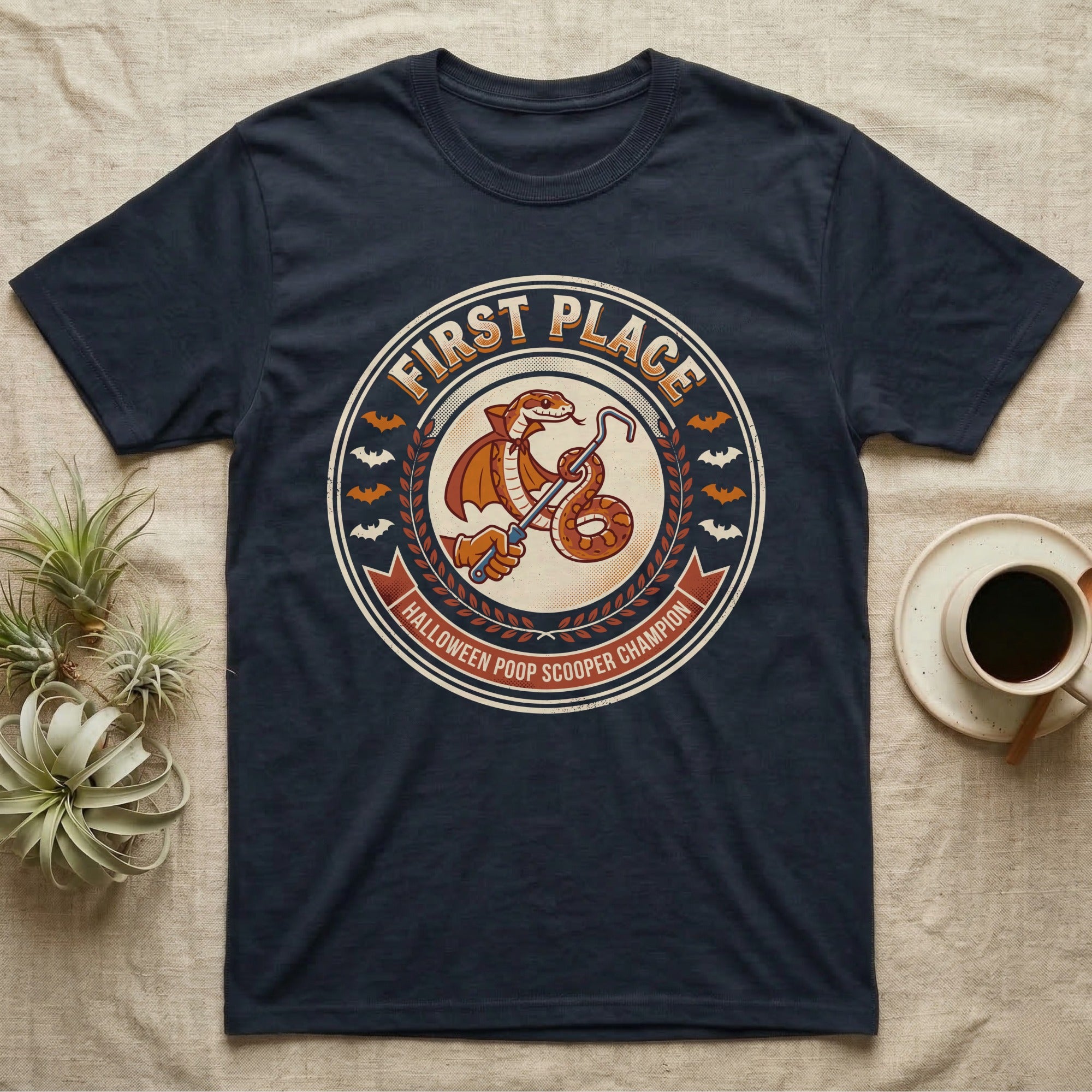 Corn Snake Poop Scooper Champion T-Shirt in Navy — Vintage award badge with a caped corn snake holding a scoop hook, "First Place Halloween Poop Scooper Champion."
