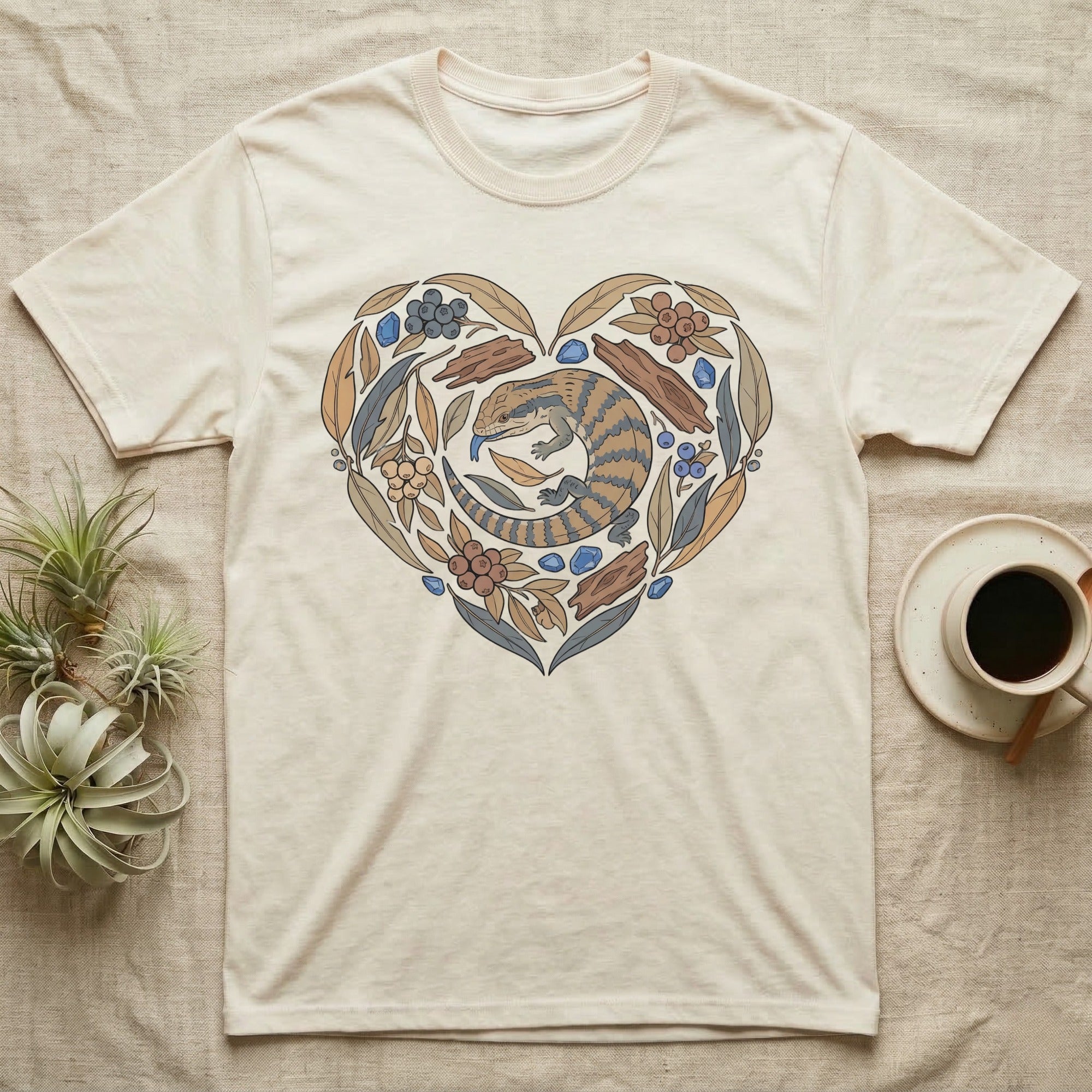T-shirt with a heart-shaped lizard and floral design.