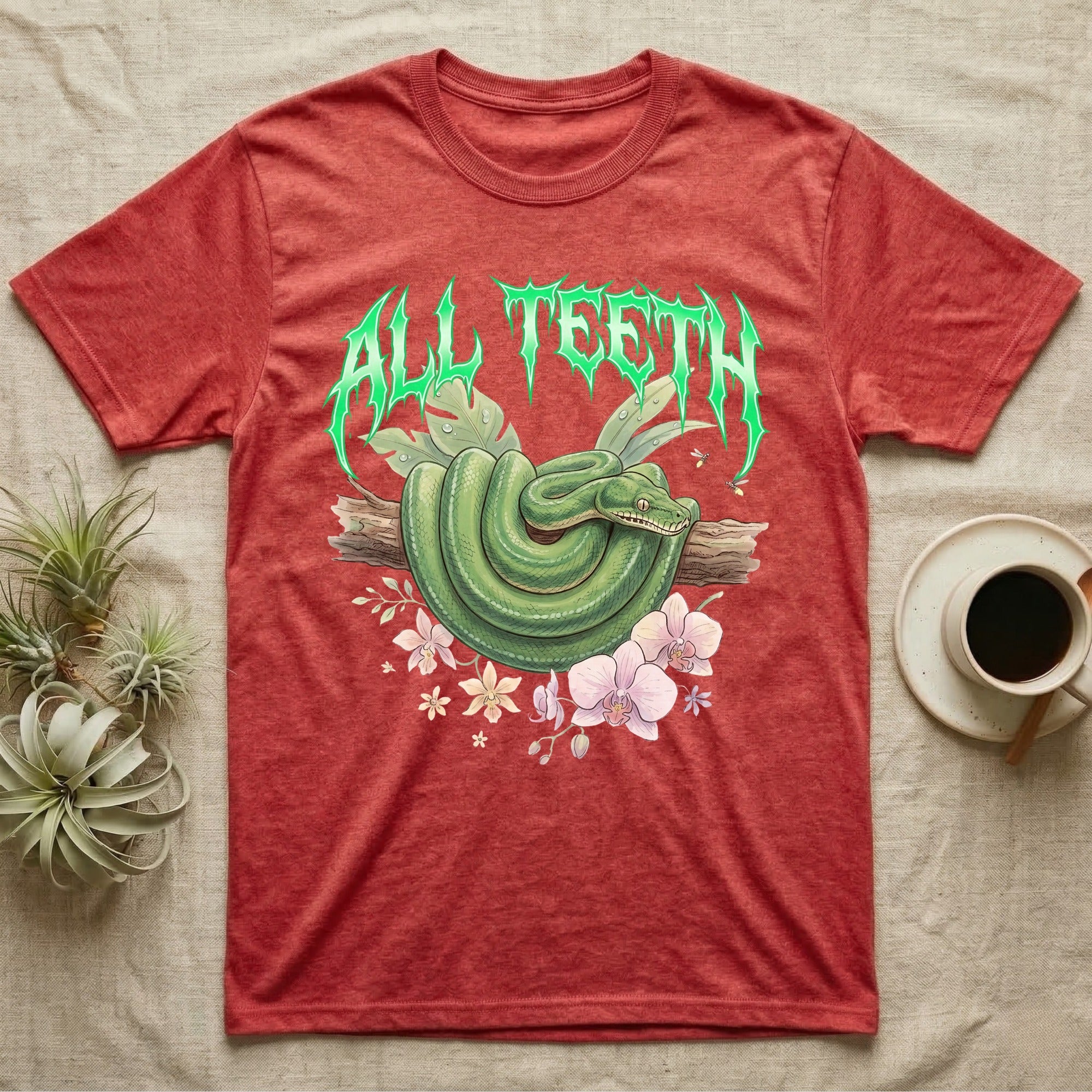 Emerald Tree Boa Feral T-Shirt in Heather Red — Coiled emerald tree boa on a branch below a dripping emerald-green metal "All Teeth" wordmark