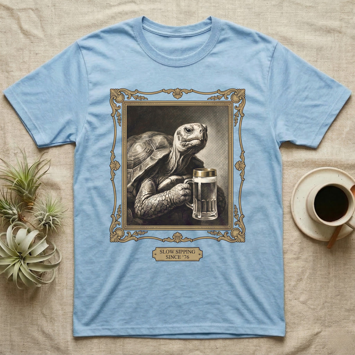 Slow Sipping Tortoise T-Shirt in Light Blue — Old-master oil portrait of a dignified tortoise holding a beer stein with a brass "Slow Sipping Since '76" plaque.