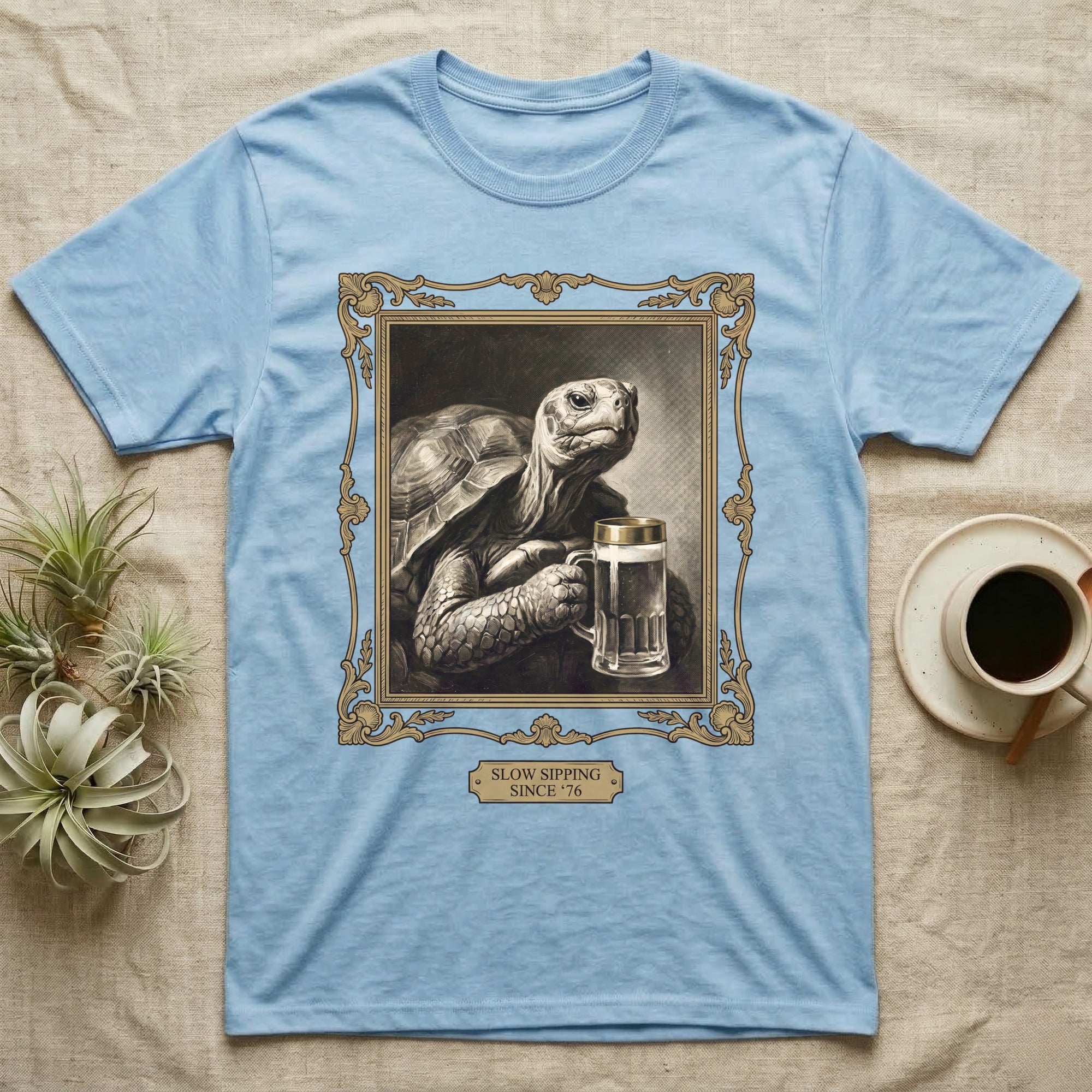 Slow Sipping Tortoise T-Shirt in Light Blue — Old-master oil portrait of a dignified tortoise holding a beer stein with a brass "Slow Sipping Since '76" plaque.