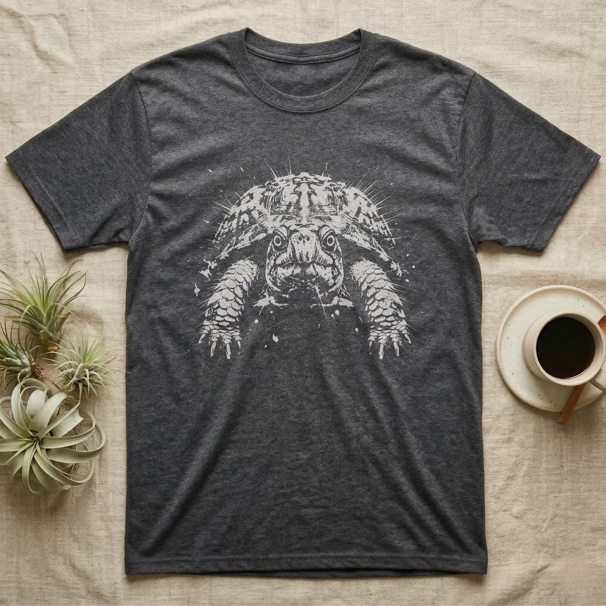 Box Turtle Face Macro T-Shirt in Dark Heather — Eastern box turtle face in extreme close-up, crushed to one pale ink on black with two round eye holes.