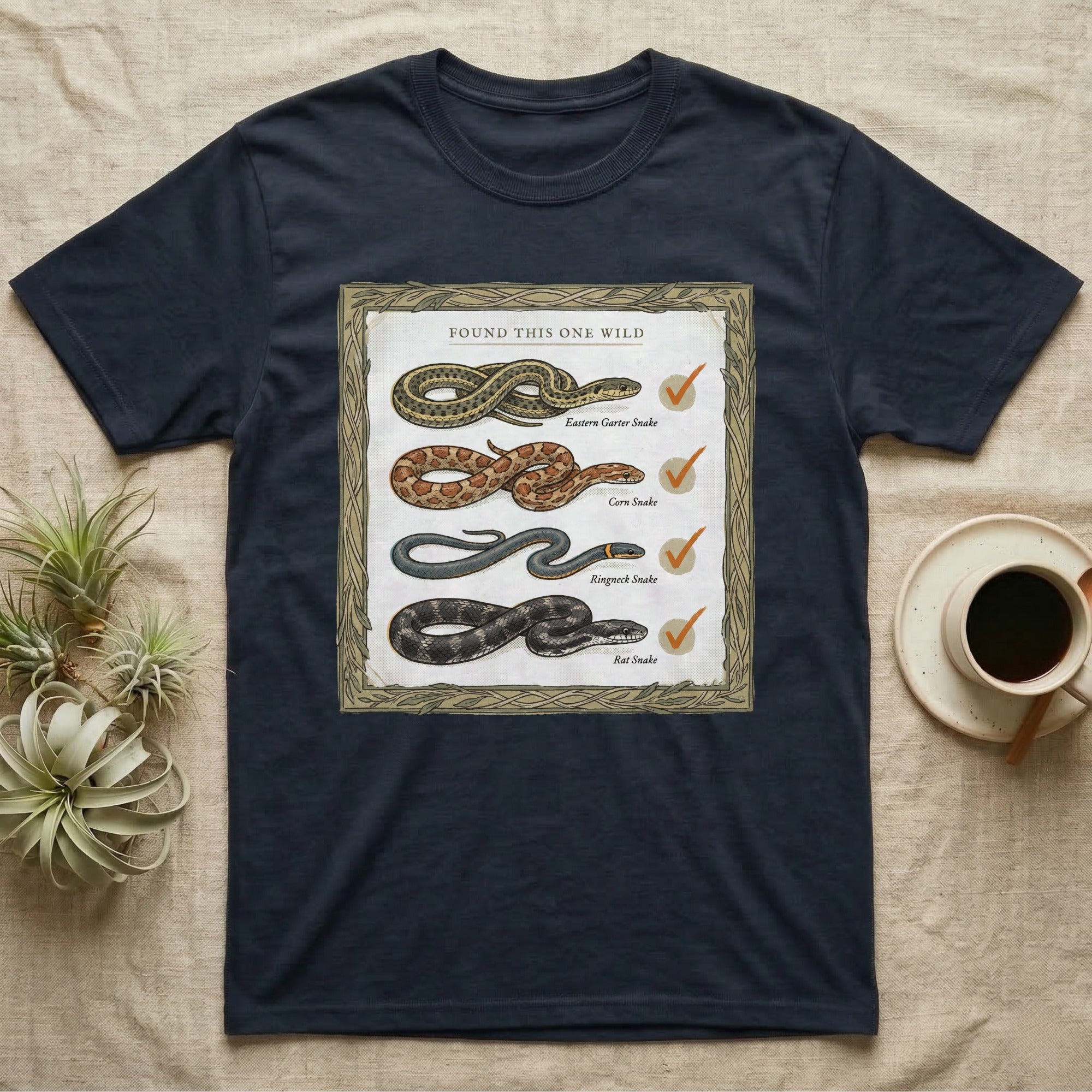 Native Snake Life List T-Shirt in Navy — Vintage field-guide life list of native snakes drawn as small specimens with tally checkmarks beside each.