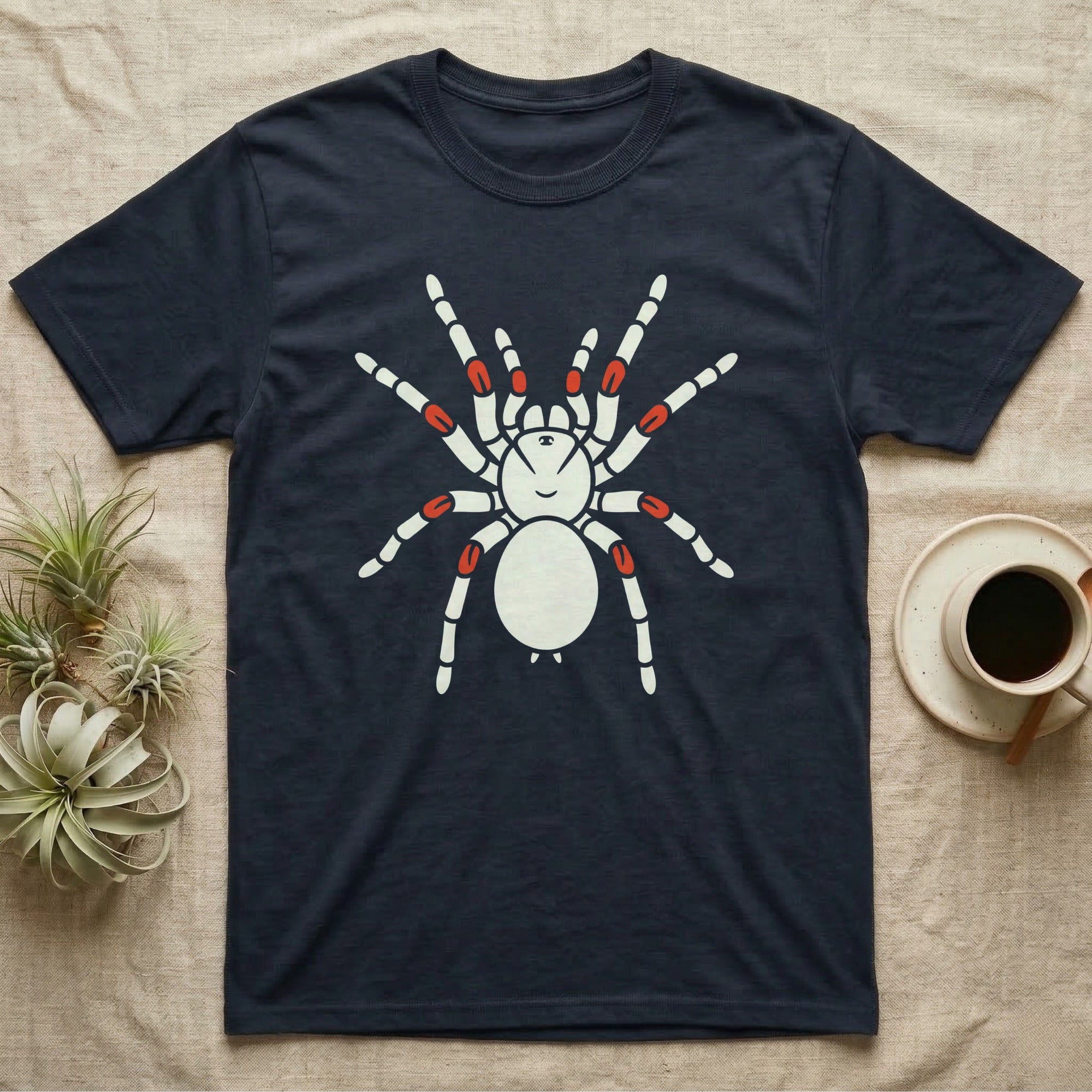 Dark navy t-shirt with a white tarantula graphic featuring red accents on its legs.