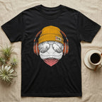 Green Anole Chill Beats T-Shirt in Black — Engraved green anole with pink dewlap showing, in a beanie and headphones, aviators reflecting tropical palms.