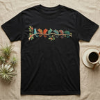 Panther Chameleon Canopy Crew T-Shirt in Black — Watercolor illustration of seven panther chameleons in Madagascar locale colours on a branch, dark grey T-shirt design.