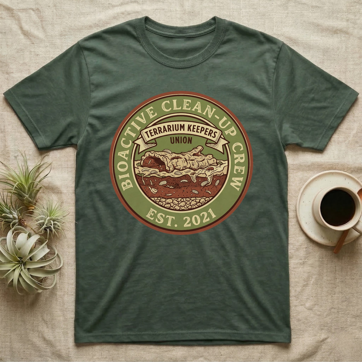 Isopod Terrarium Keepers Union T-Shirt in Military Green — Vintage union badge showing a cross-sectioned bioactive vivarium worked by isopods and springtails.