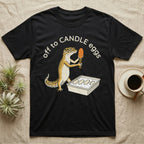 Leopard Gecko Candling T-Shirt in Black — Leopard gecko holding a torch under a glowing orange egg beside a tub of eggs, under the words off to CANDLE eggs