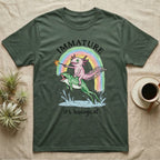 Axolotl Immature T-Shirt in Military Green — Crayon drawing of a pink axolotl riding a leaping green frog through a rainbow, sparkler lit, under IMMATURE