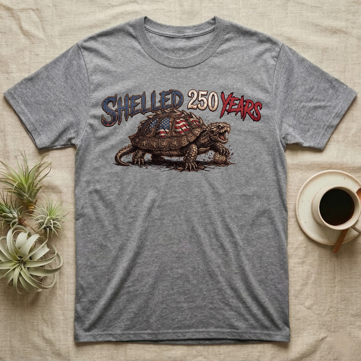 Snapping Turtle 250 T-Shirt in Sport Grey — Gritty woodcut alligator snapping turtle with a flag-etched shell on a 250 coin under text Shelled 250 Years.