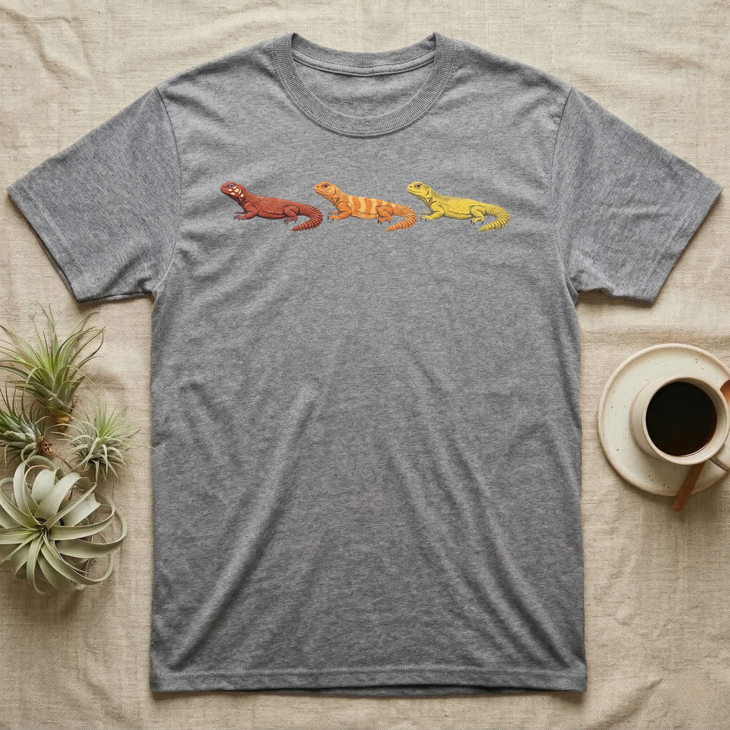 Uromastyx Colour Morph Trio T-Shirt in Sport Grey — Three uromastyx lizards in a row, painted in thick raised relief — brick red, tangerine orange and lemon yellow morphs.