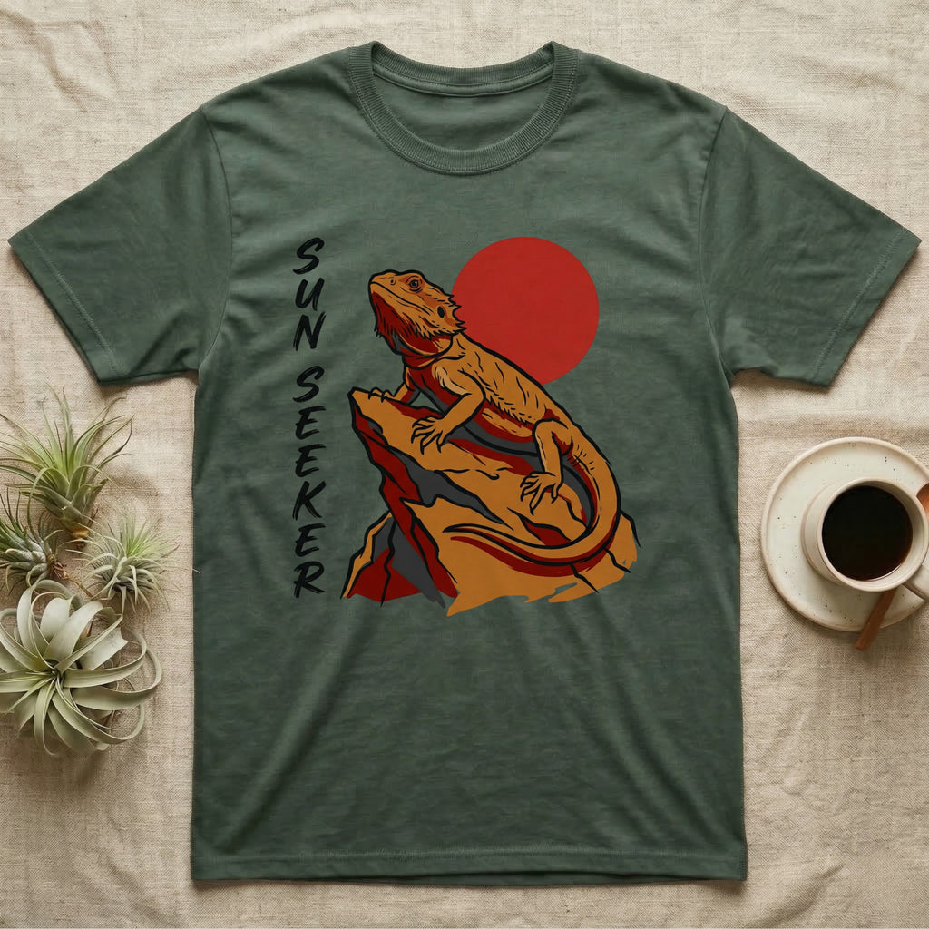 Dark green t-shirt with a bearded dragon illustration and "SUN SEEKER" text.