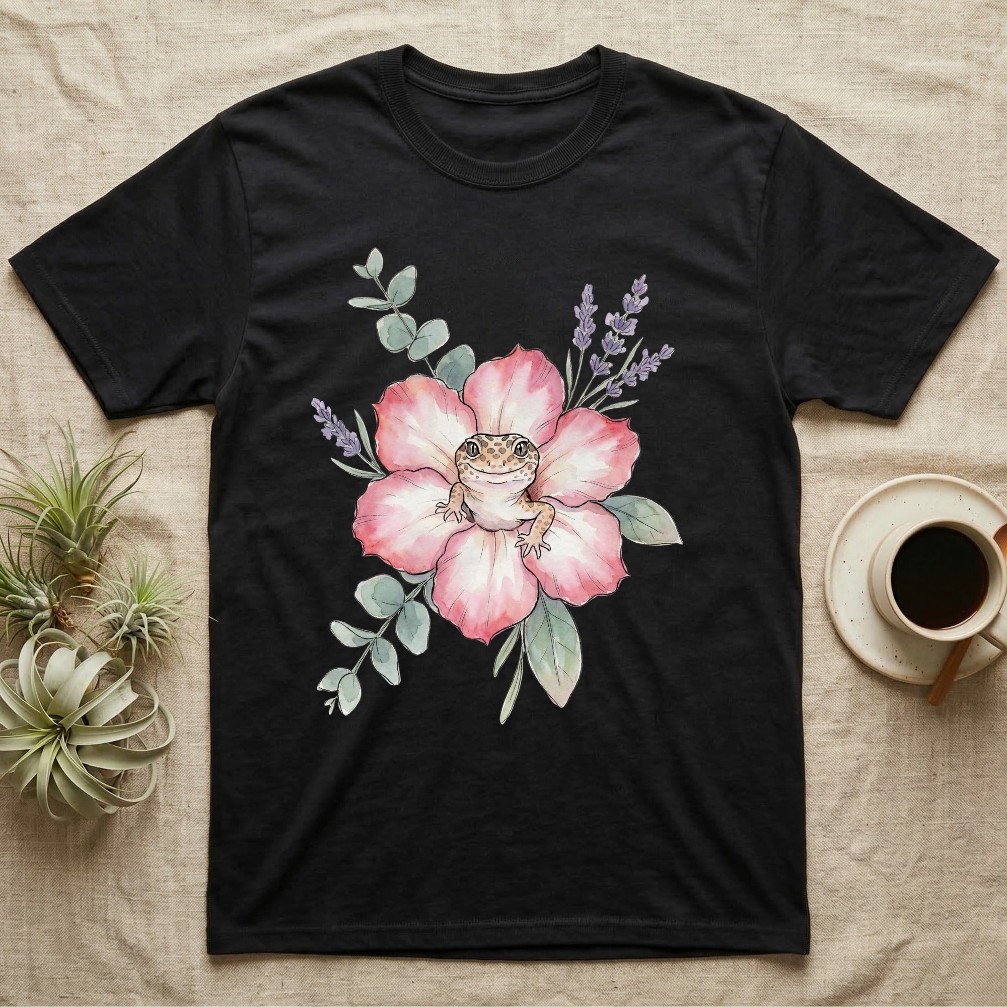 Black t-shirt with watercolor gecko and flowers design.