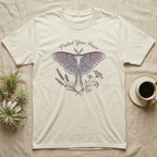 Cream t-shirt with moth and floral graphic and text "Protect Your Peace".