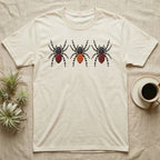 Velvet Spider Triptych T-Shirt in Natural — Three velvet spiders in a row, painted in thick impasto, each with a differently coloured red-and-black abdomen.