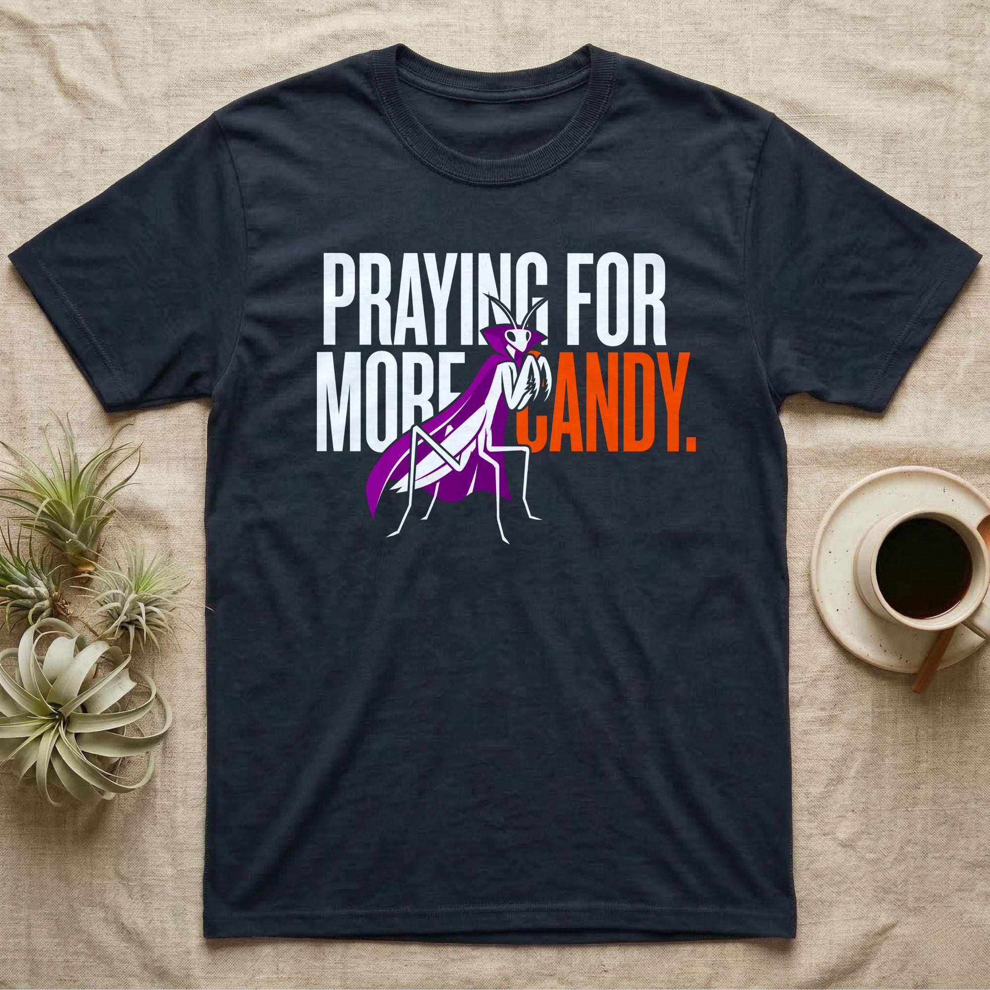 Ghost Mantis Praying For Candy T-Shirt in Navy — Minimalist caped ghost mantis rearing up through bold text, "Praying for More Candy."