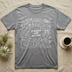 Terrarium Keeper One Tank T-Shirt in Sport Grey — White outline illustration of eleven terrarium species — bearded dragon, crested gecko, ball python, axolotl, tortoise, tarantula, isopod, whip spider, chameleon, tree frog and hognose — with pothos and fern leaves, ringed around the script line it started with one tank.
