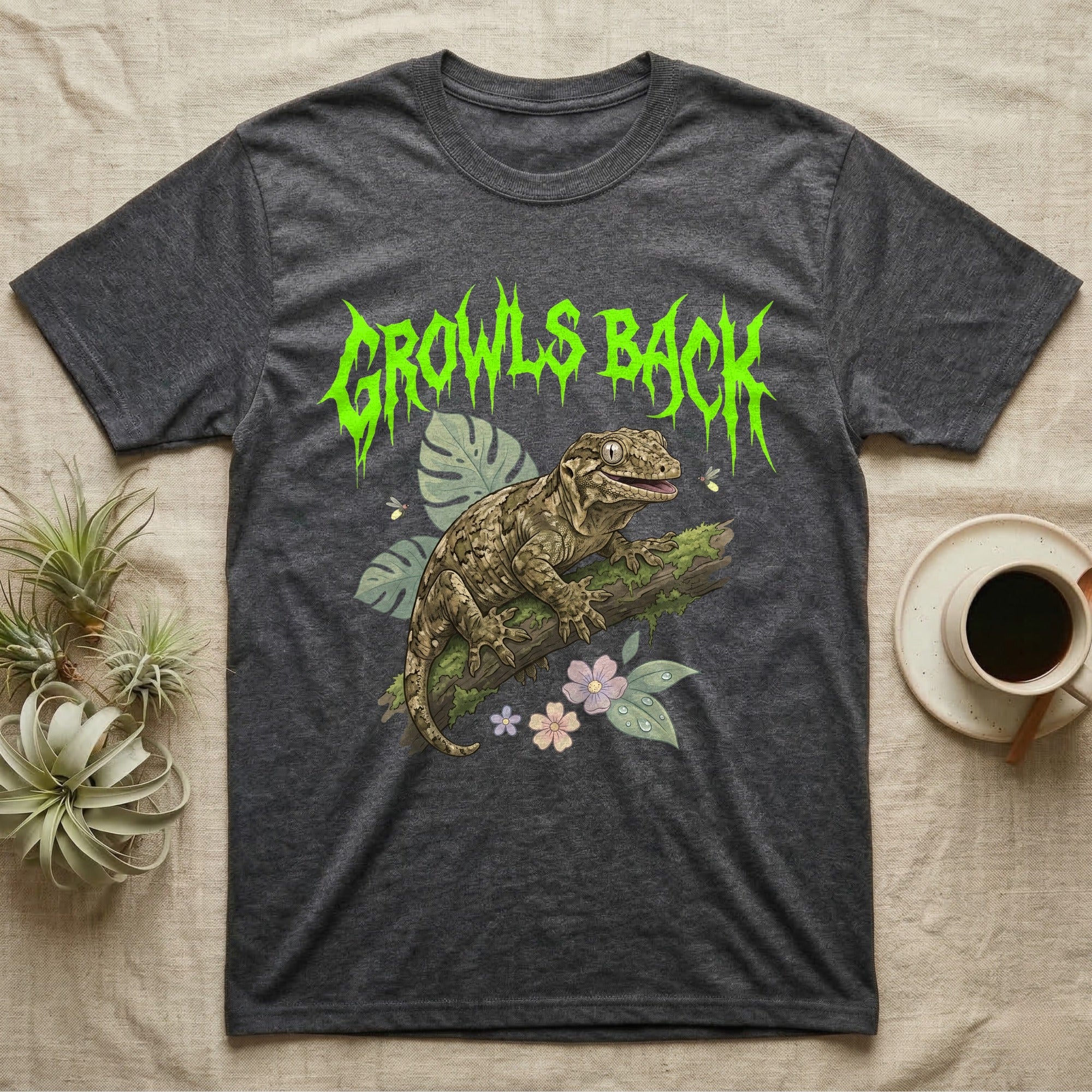 Leachianus Gecko Feral T-Shirt in Dark Heather — Leachianus giant gecko on a mossy branch under jagged lime-green metal text GROWLS BACK with pastel leaves