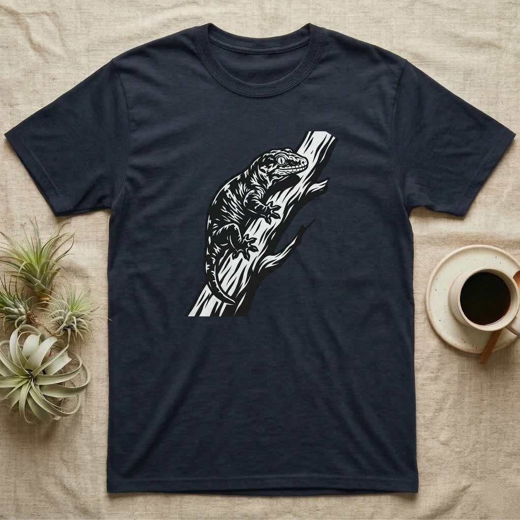 Dark t-shirt with a black and white lizard graphic on a tree branch.