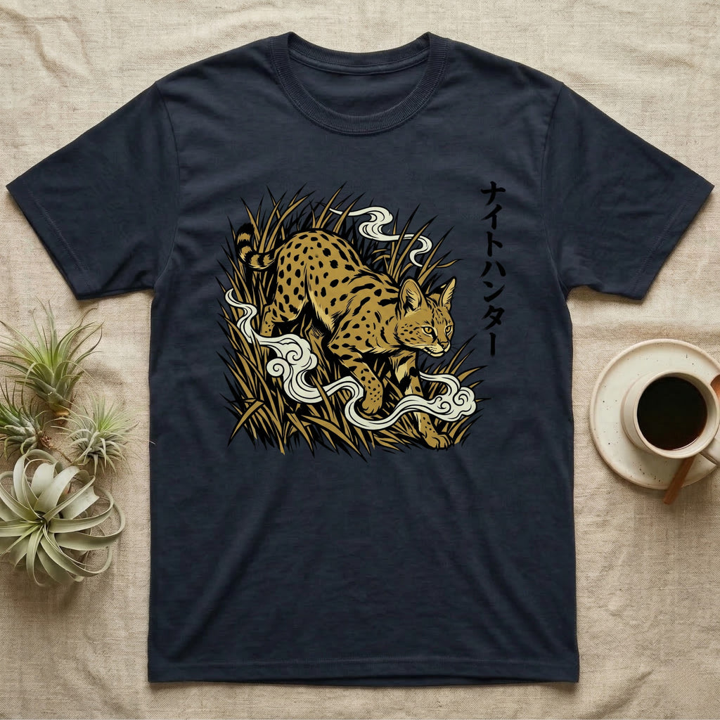 Dark t-shirt with spotted cat and Japanese text in tall grass.