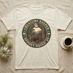 Creature Keeper Spooky Squad T-Shirt in Natural — Embroidered-patch badge with a gecko, chameleon, snake and tarantula in a stone archway, "Creature Keeper Spooky Squad."