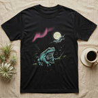 White's Tree Frog Moonlit T-Shirt in Black — Airbrushed White's tree frog rising from moonlit water toward a cream full moon, cyan and pink glow on black.