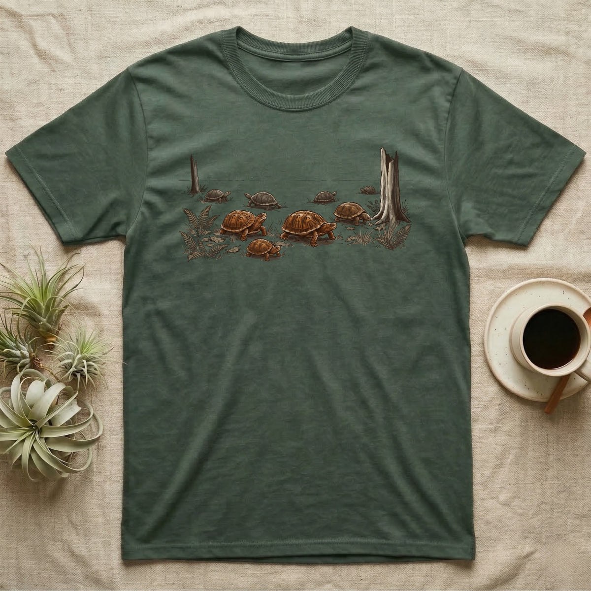 Box Turtle Forest Floor T-Shirt in Military Green — Sepia ink and wash illustration of eight eastern box turtles crossing open woodland between two deadfall trunks.