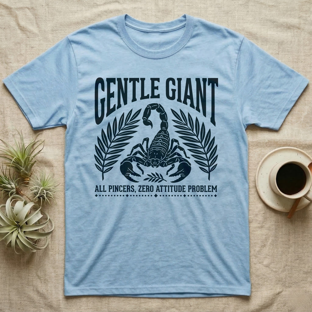 Emperor Scorpion Gentle Giant T-Shirt in Light Blue — Folk woodblock crest of an emperor scorpion under an arched GENTLE GIANT headline, flanked by palm fronds.
