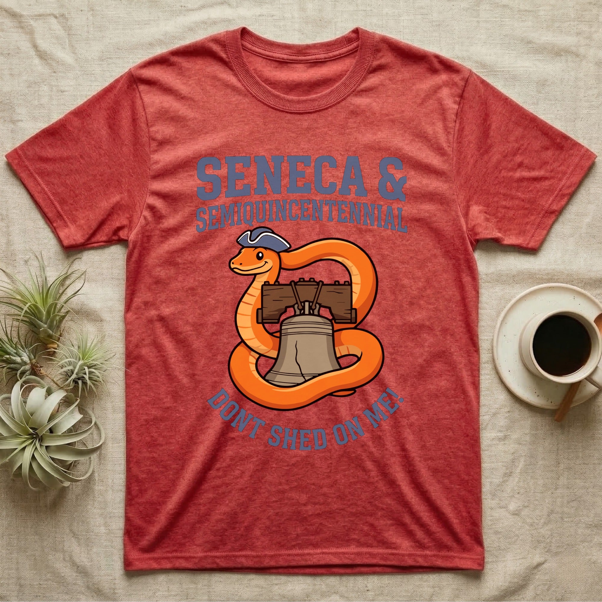 Corn Snake Don't Shed T-Shirt in Heather Red — Cartoon orange snake in a tricorn hat coiled around the Liberty Bell with text Don't Shed On Me.