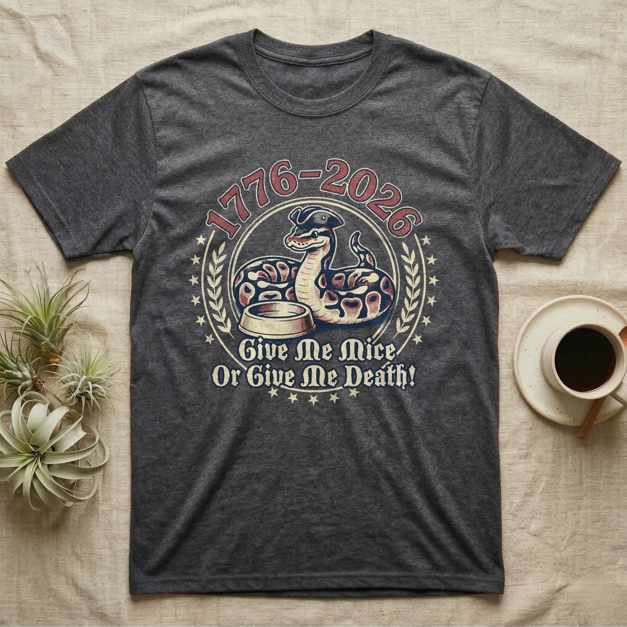 Ball Python 1776 T-Shirt in Dark Heather — Vintage distressed badge of a ball python in a feeding strike over a food dish, cream and brick-red emblem reading Give Me Mice Or Give Me Death.