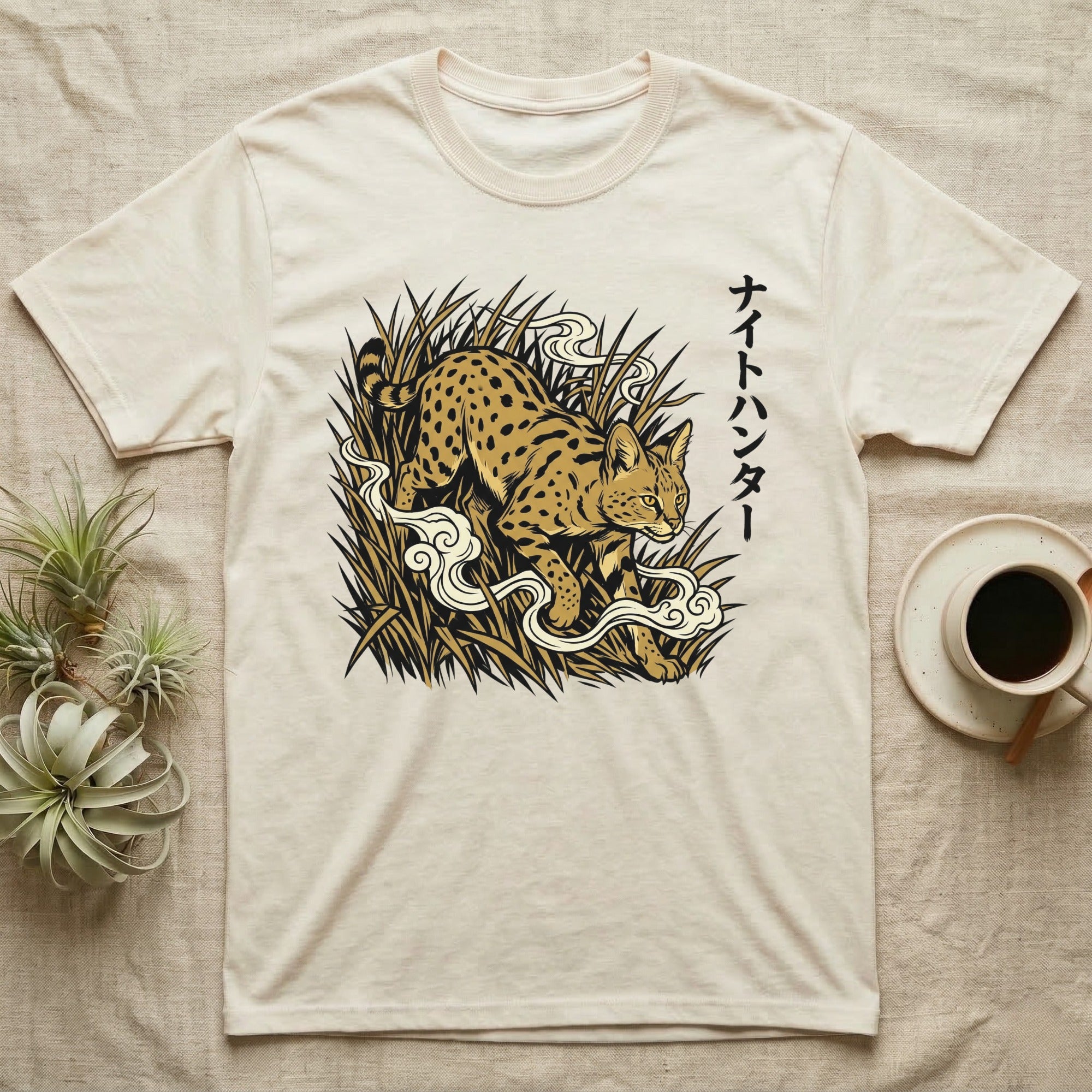 Cream t-shirt with a serval cat illustration and Japanese text.