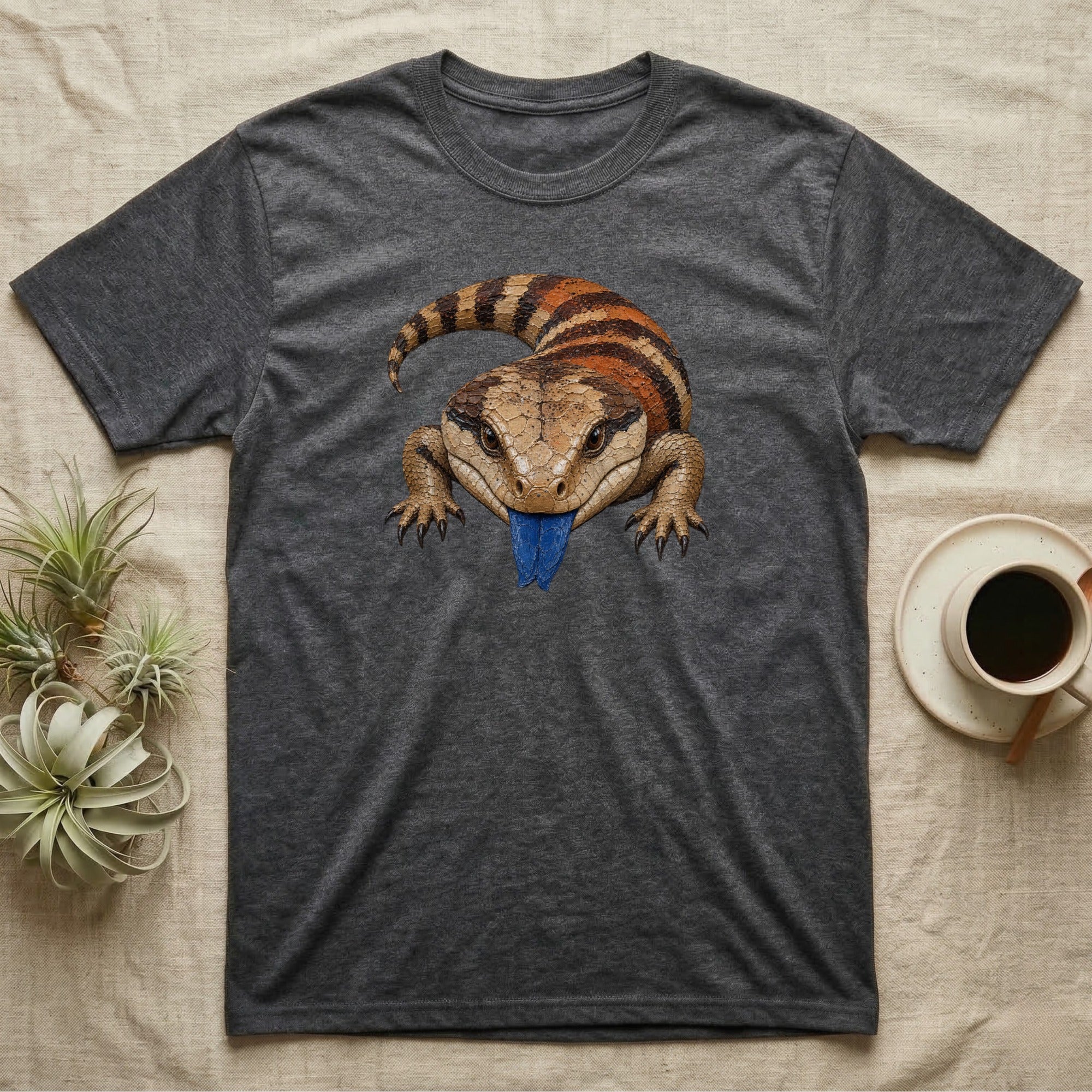 Dark grey t-shirt featuring a blue-tongued skink illustration.