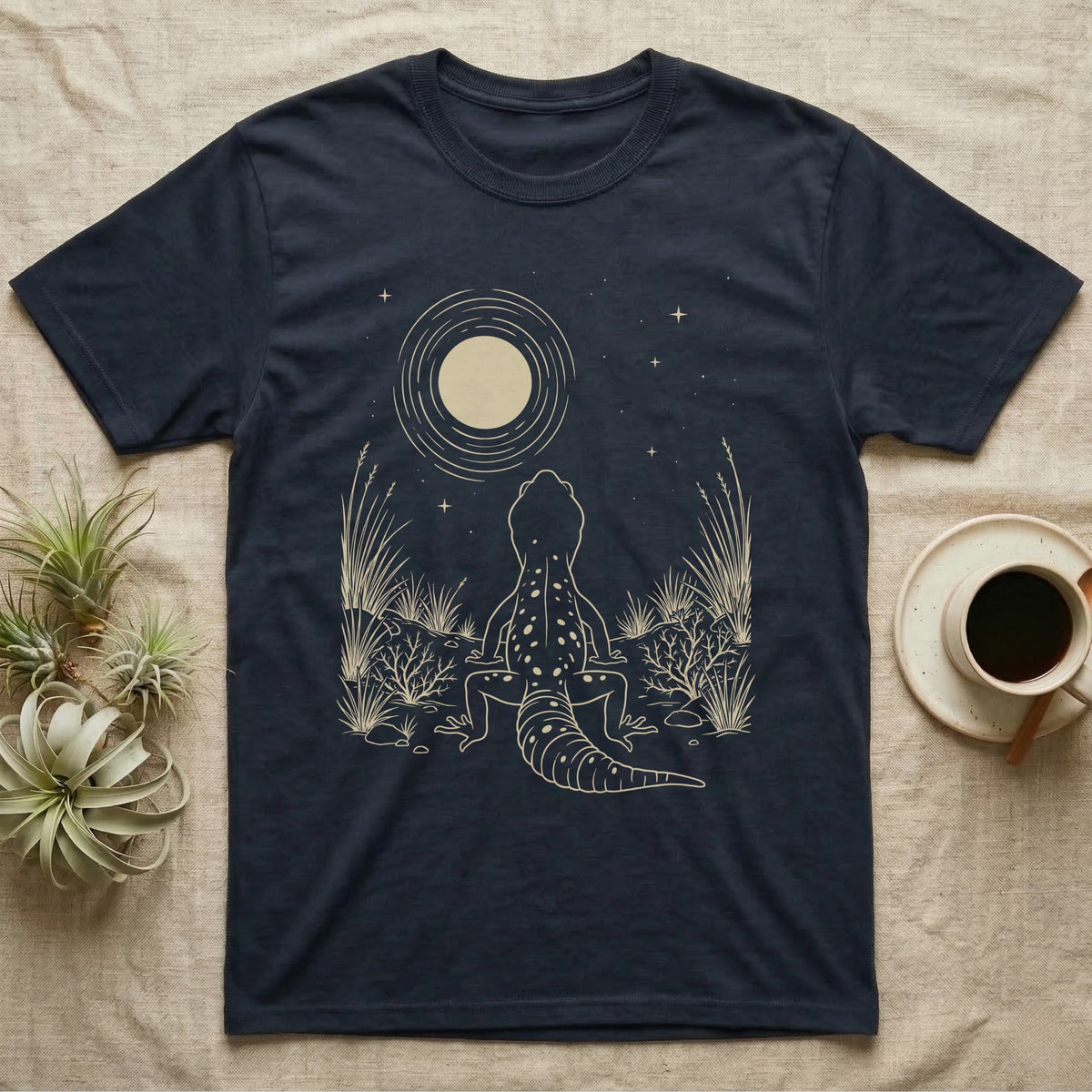Leopard Gecko Moon T-Shirt in Navy — Scratchboard illustration of a leopard gecko seen from behind, looking up at a scratched moon over dry grasses.